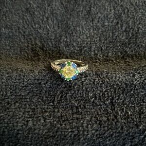 Super cute ring with blue and green stones surrounding very light yellow stone